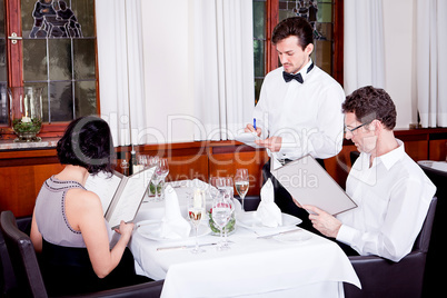 man and woman in restaurant for dinner