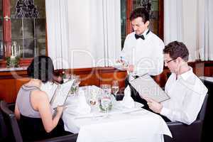 man and woman in restaurant for dinner