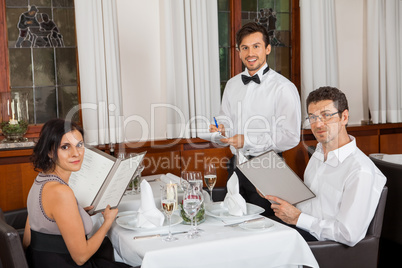 young smiling couple at the restaurant