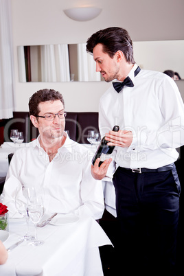 couple drinking red wine in restaurant