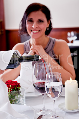 couple drinking red wine in restaurant