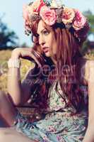 beautfiul woman outdoor in summer with flowers on head