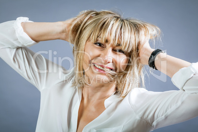 Smiling confident middle-aged blond woman