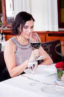 couple drinking red wine in restaurant