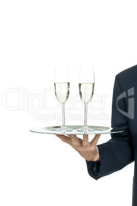 adult male waiter serving two glass of champagne isolated