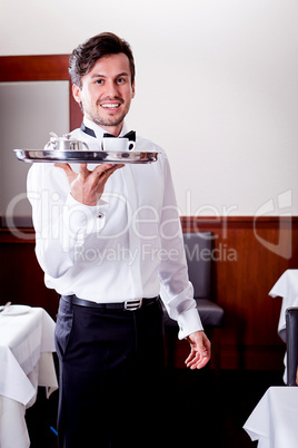 waiter serve fresh espresso for happy couple