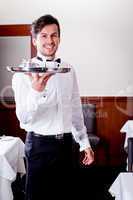 waiter serve fresh espresso for happy couple
