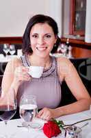 waiter serve fresh espresso for happy couple