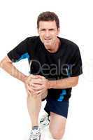 adult attractive man in sportswear knee pain injury ache isolated