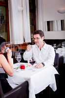 waiter serve fresh espresso for happy couple