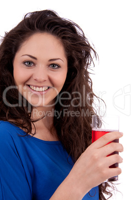 beautiful smiling brunette woman is drinking red juice