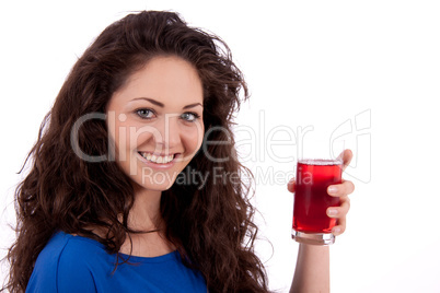 beautiful smiling brunette woman is drinking red juice