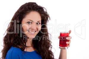 beautiful smiling brunette woman is drinking red juice