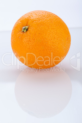 Fresh orange halved to show the pulp