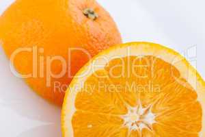 Fresh orange halved to show the pulp