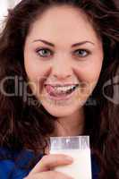 beautiful smiling woman is drinking milk