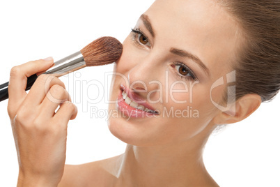 apllying powder make up on face portrait