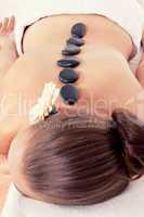 attractive helathy caucasian woman hot stone massage wellness