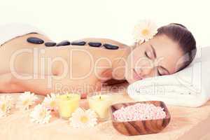 attractive helathy caucasian woman hot stone massage wellness