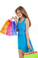 attractive young woman with colorful shopping bags isolated