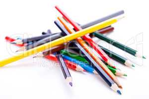 Bunch of colourful pencil crayons on white