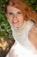 beautiful smiling young redhead woman portrait outdoor