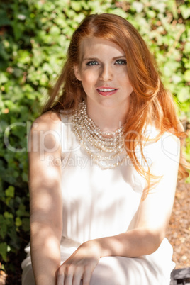 beautiful smiling young redhead woman portrait outdoor