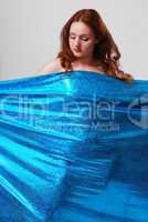 Nude woman behind the cloth strained