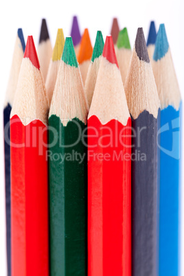 Bunch of colourful pencil crayons on white