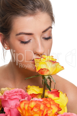 attractive young smiling woman with flowers roses isolated