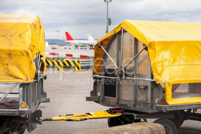 Trolleys loaded with luggage at an airport