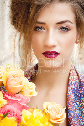 attractive young woman with pink roses
