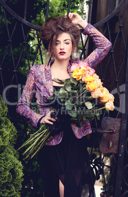 attractive young woman with pink roses