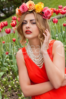 beautiful woman with roses outdoor summertime
