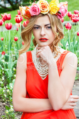 beautiful woman portrait outdoor with colorful flowers