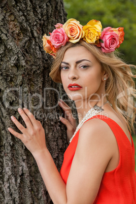 beautiful woman portrait outdoor with colorful flowers