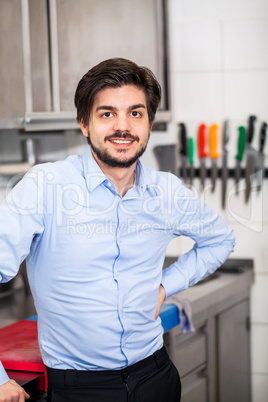 Friendly attractive man in a commercial kitchen
