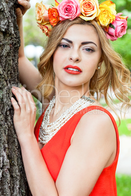 beautiful woman portrait outdoor with colorful flowers