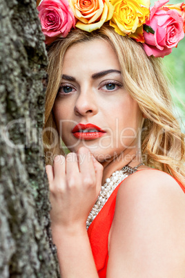 beautiful woman portrait outdoor with colorful flowers