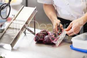 Chef slicing boiled beetroot
