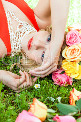 beautiful woman portrait outdoor with colorful flowers