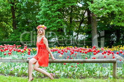 beautiful woman portrait outdoor with colorful flowers