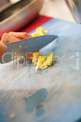 Chef chopping salad ingredients
