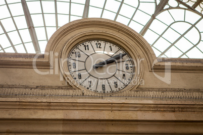 Clock in a stone building facade