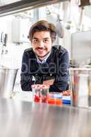 Chef cooking a vegetables stir fry over a hob