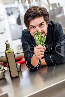 Chef checking the freshness of a bunch of herbs