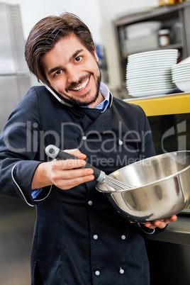 Chef taking a call on his smartphone