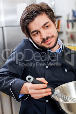 Chef taking a call on his smartphone