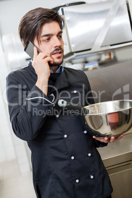 Chef taking a call on his smartphone