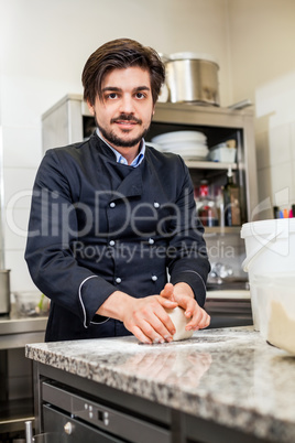 Chef tossing dough while making pastries